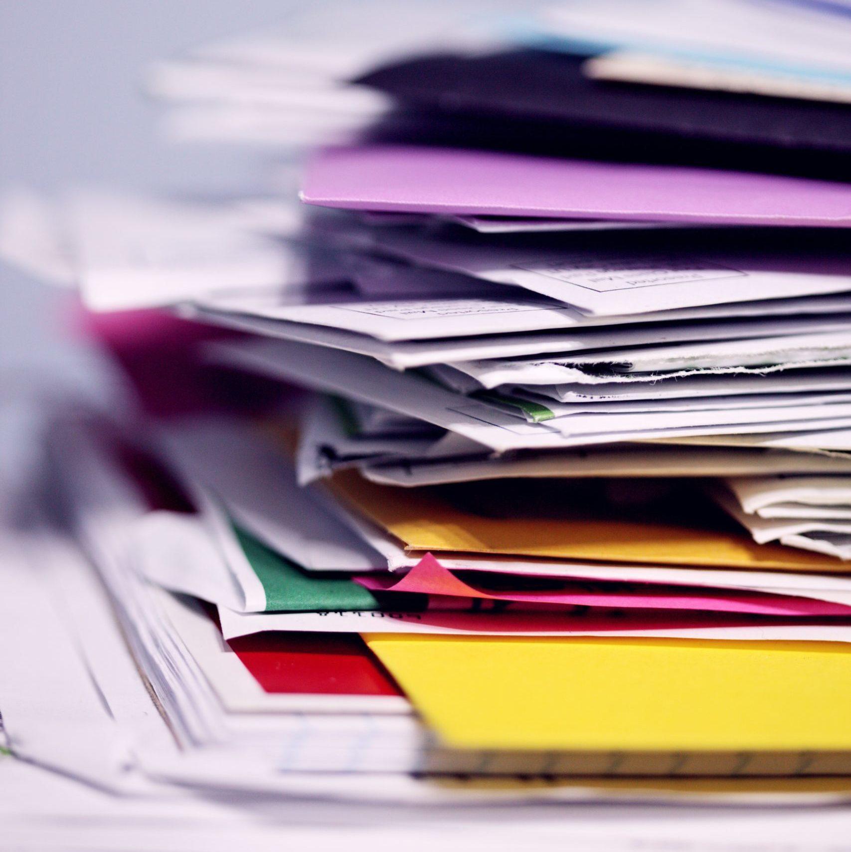 stack of bills messy old unorganized system