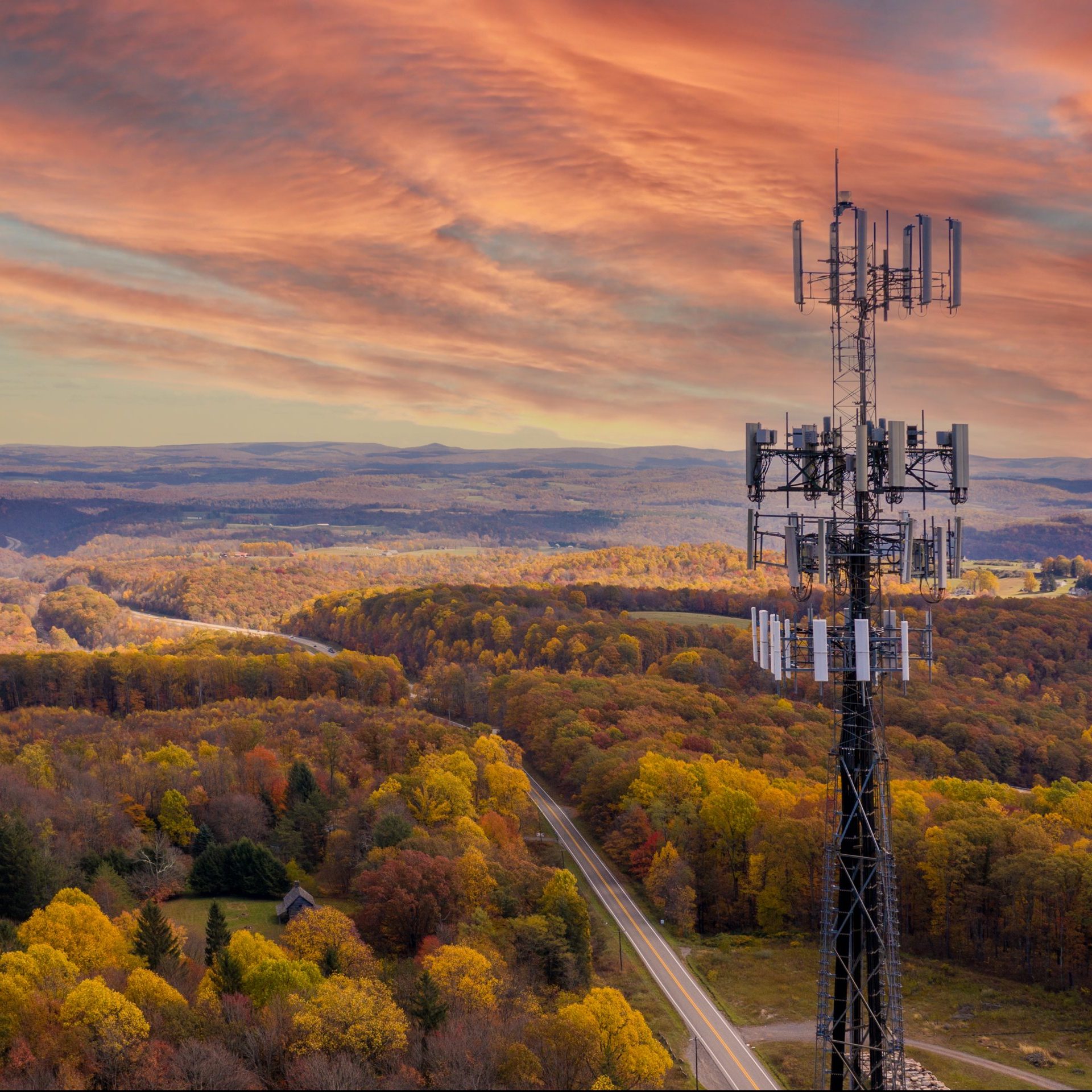 Aerial,View,Of,Mobile,Phone,Cell,Tower,Over,Forested,Rural